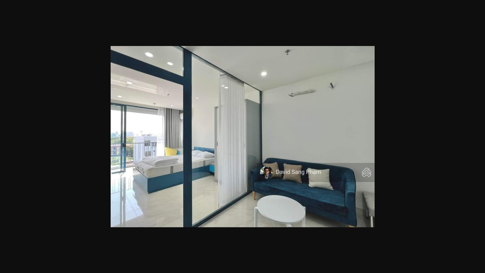 Modern Studio with Blue Accents and City View