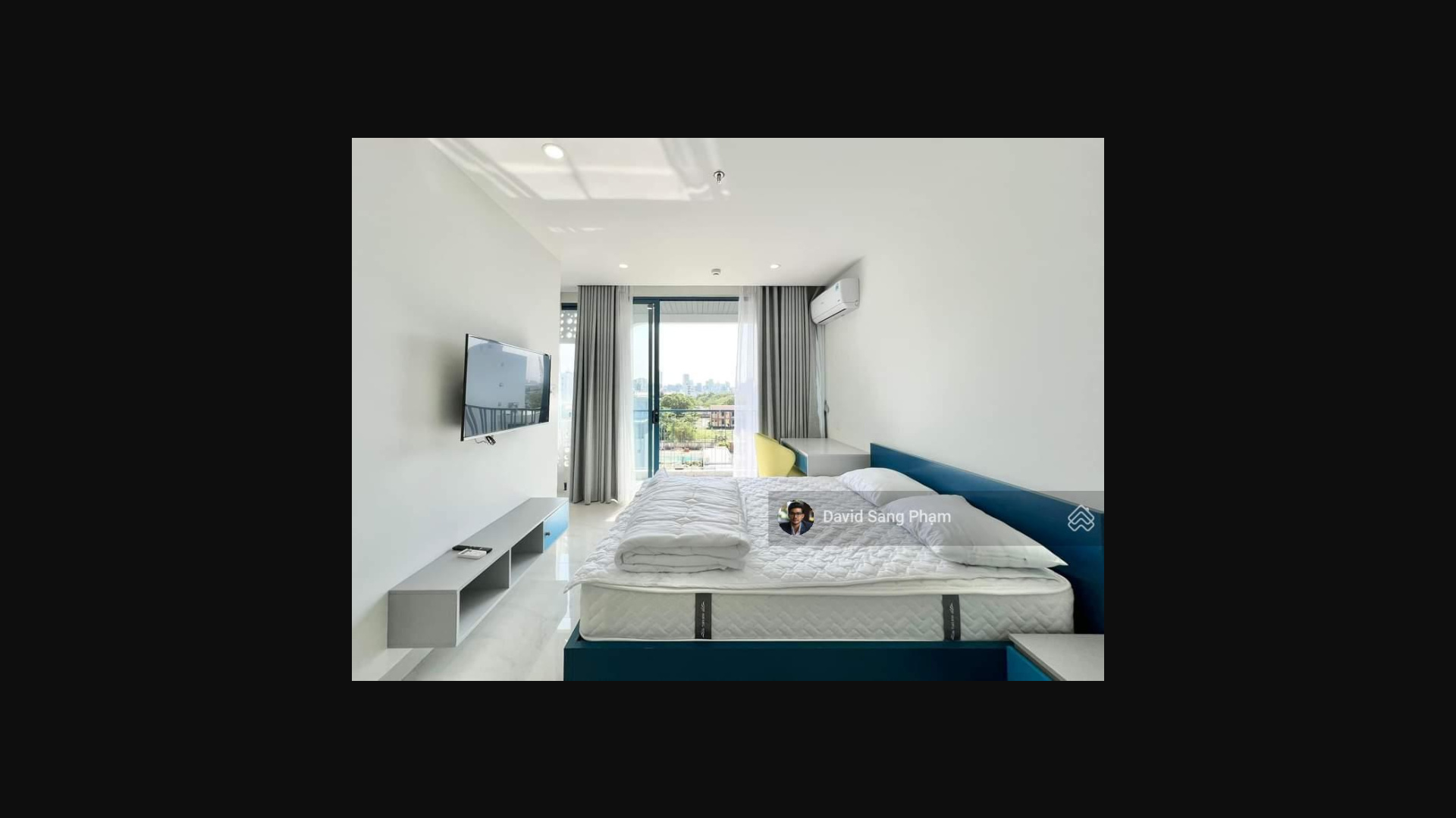 Modern Studio with Blue Accents and City View
