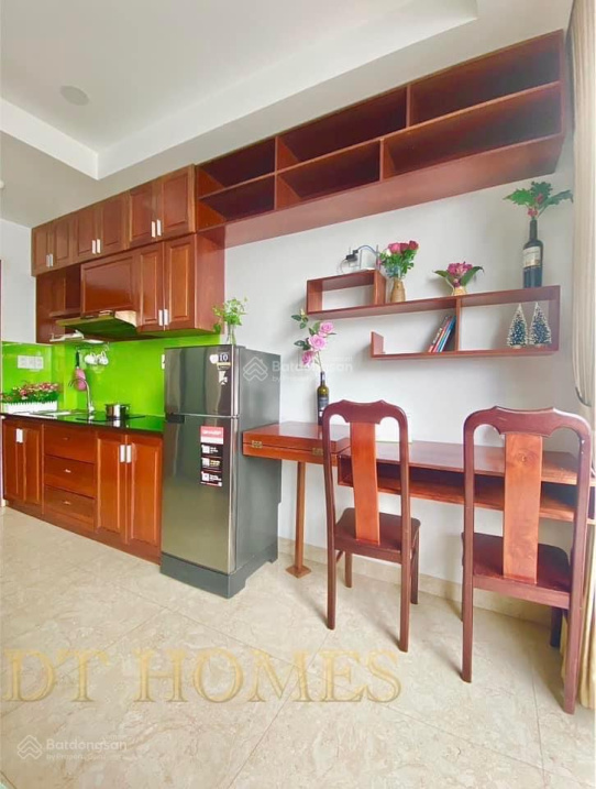 Modern Furnished Studio with Green Kitchen Accents