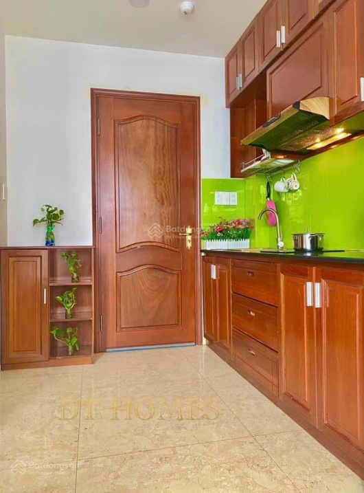 Modern Furnished Studio with Green Kitchen Accents