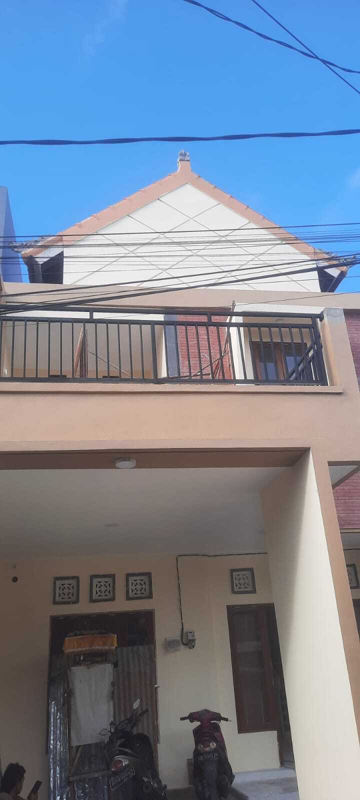 Two-Story House with Balcony and Garden