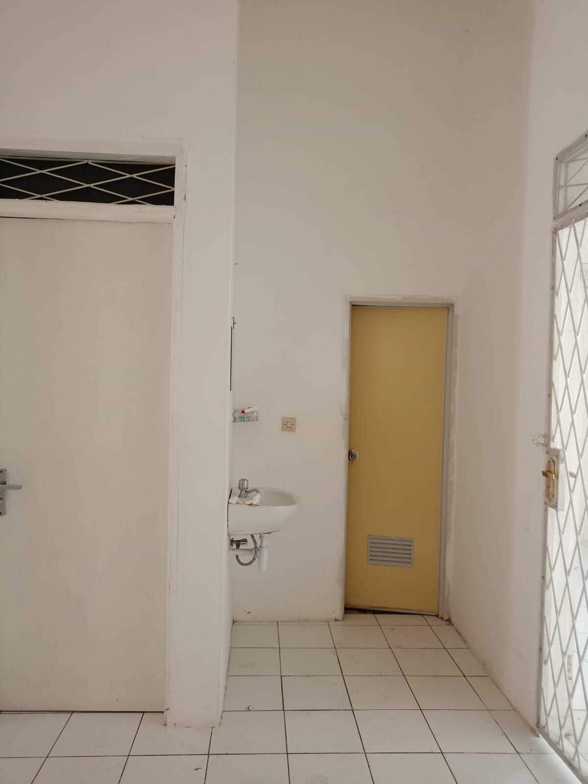 Compact Residential Unit with Multiple Rooms and Basic Amenities