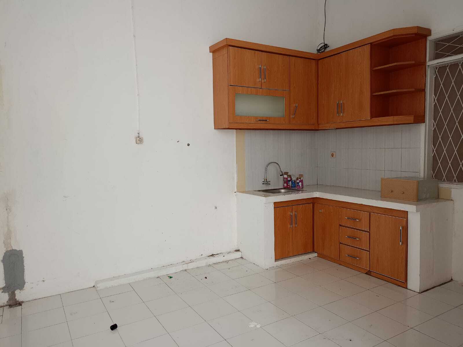 Compact Residential Unit with Multiple Rooms and Basic Amenities