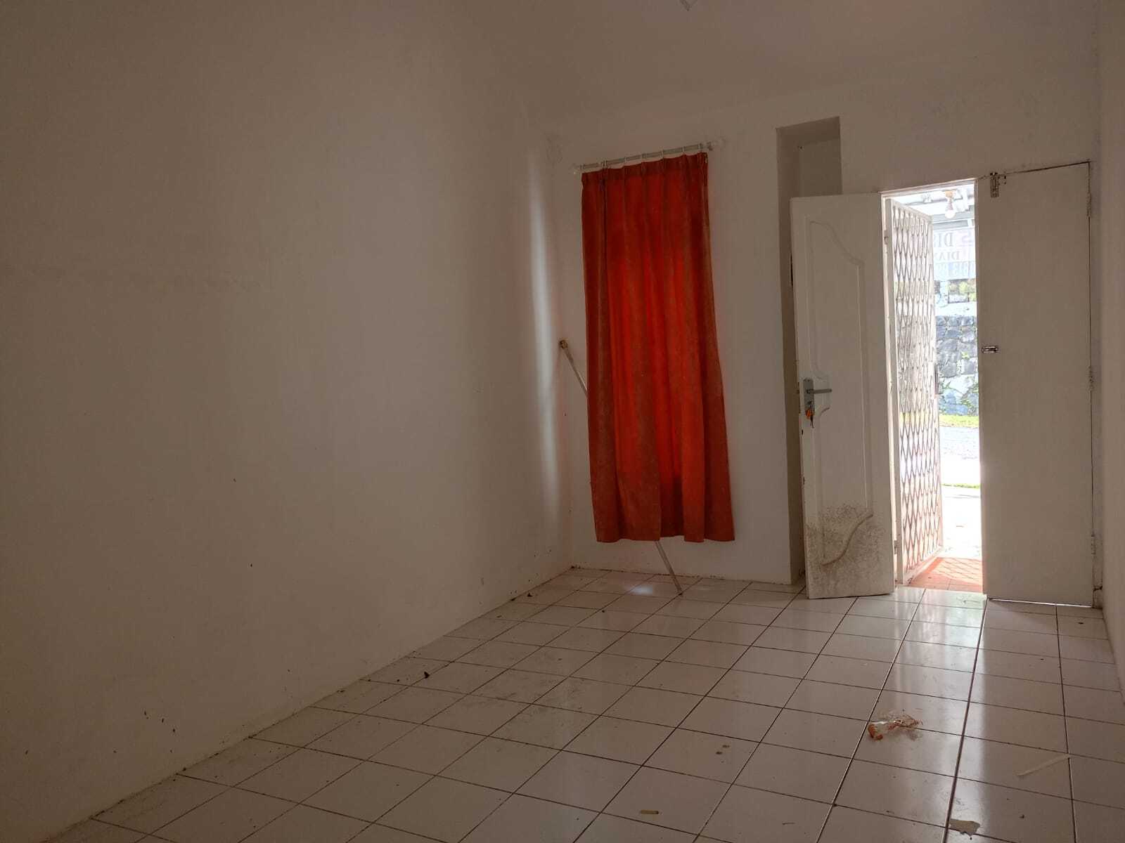 Compact Residential Unit with Multiple Rooms and Basic Amenities