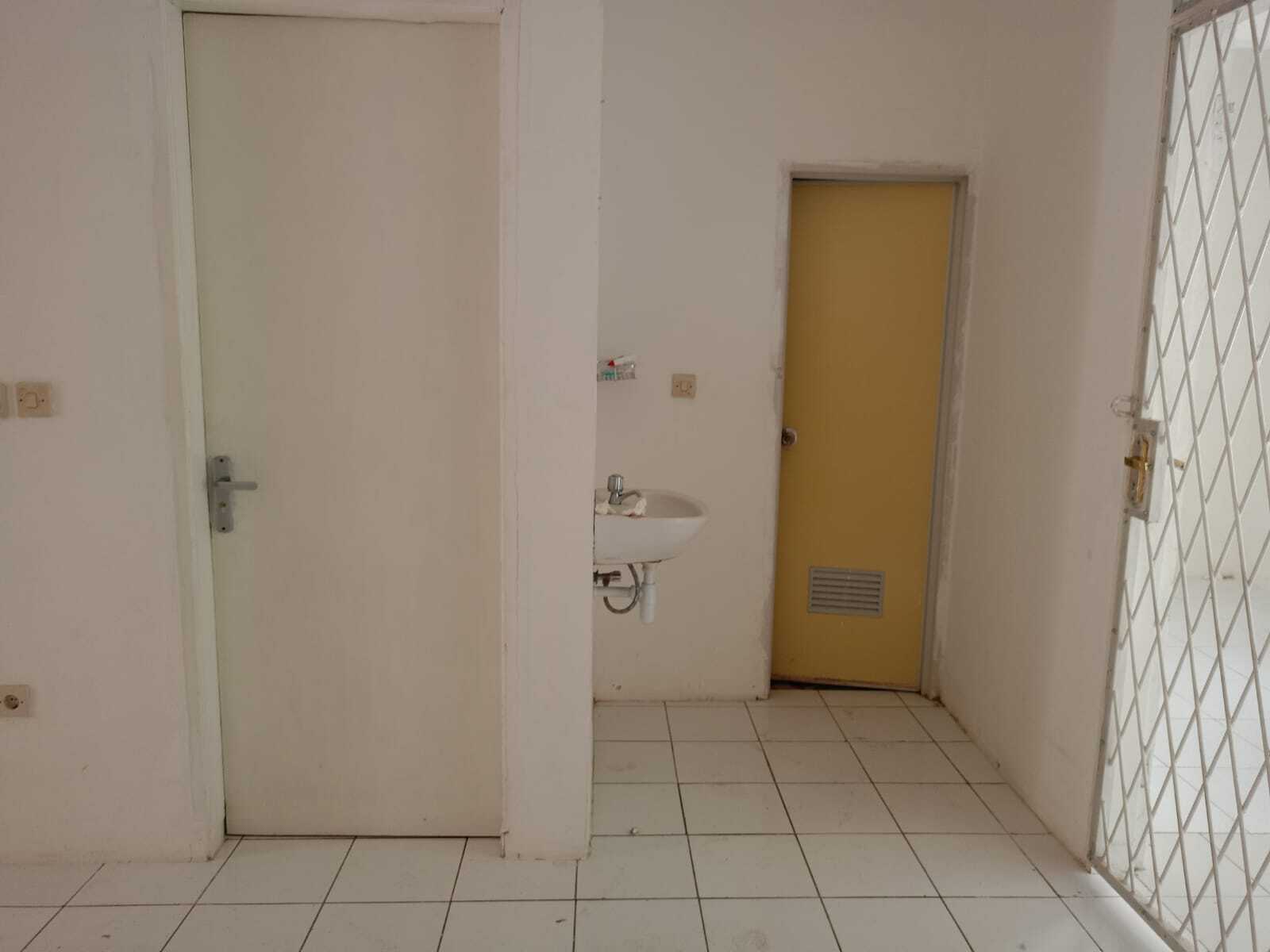 Compact Residential Unit with Multiple Rooms and Basic Amenities
