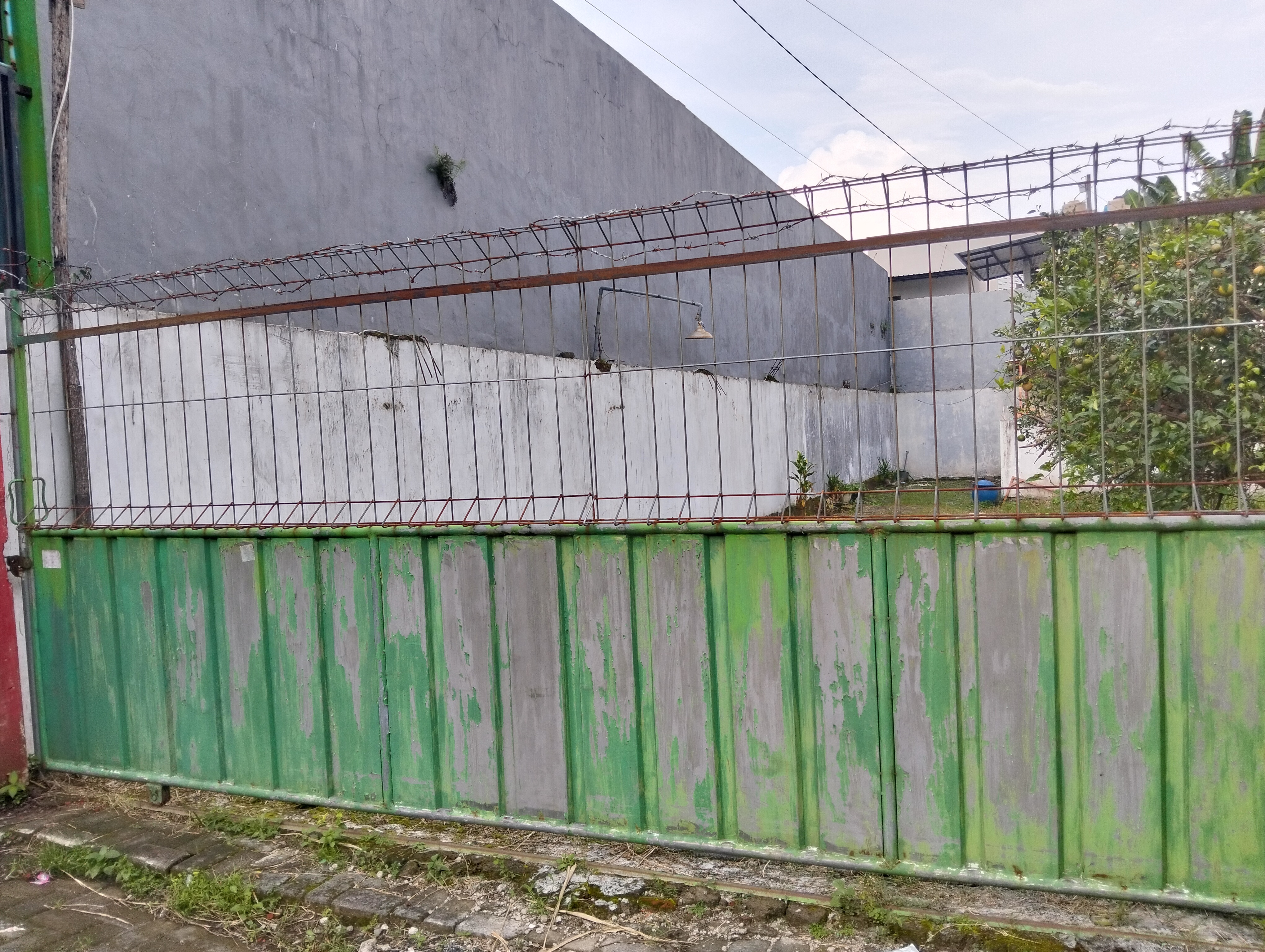 Minimalist 2-Bedroom House in Merjosari Malang with Extensive Garden