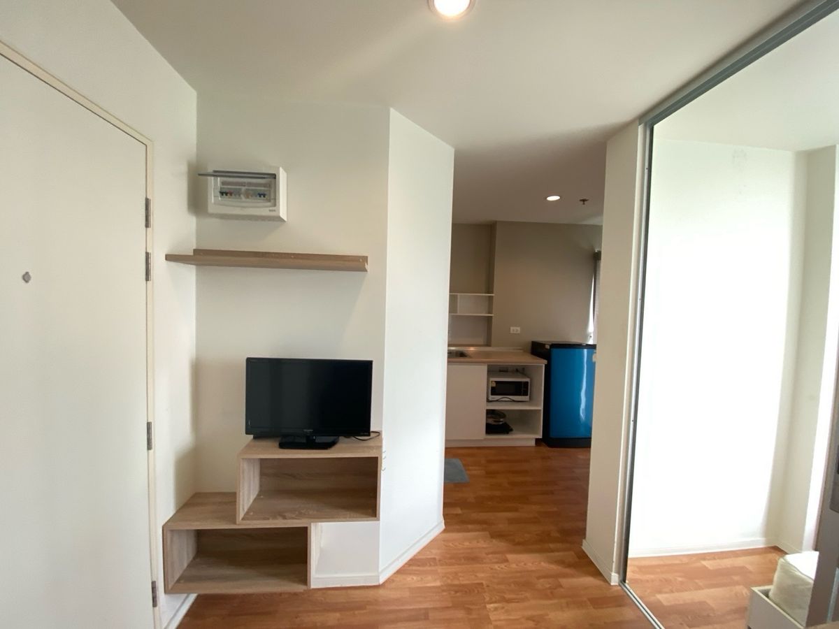 Compact Studio Apartment with Balcony and City View