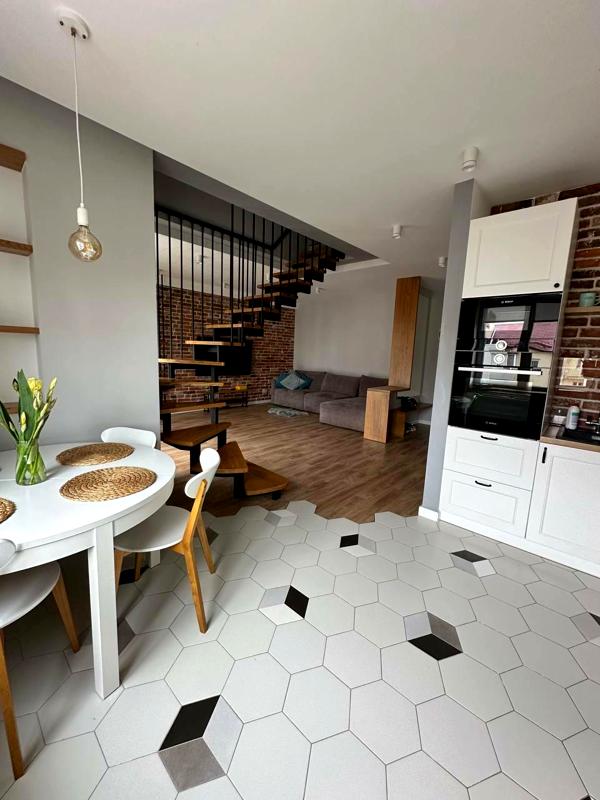 Premium Two-Level Apartment with Designer Renovation in Quiet Green Area