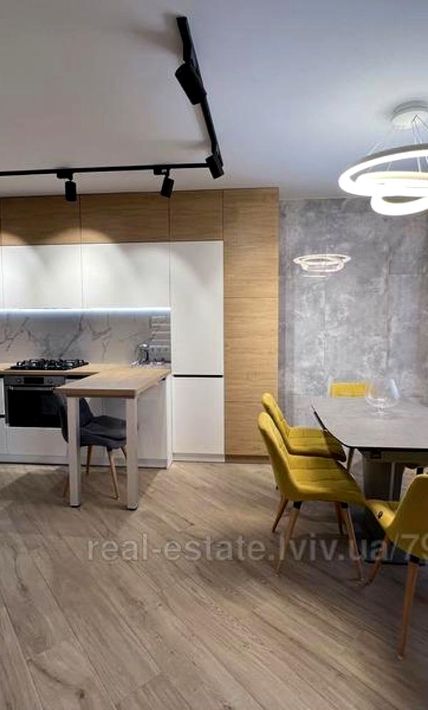Modern Two-Level Apartment with Designer Renovation and Full Amenities