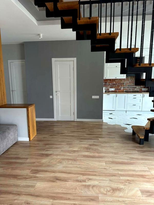 Premium Two-Level Apartment with Designer Renovation in Quiet Green Area