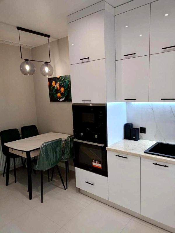 Modern 1-room apartment with studio kitchen in Parус City complex