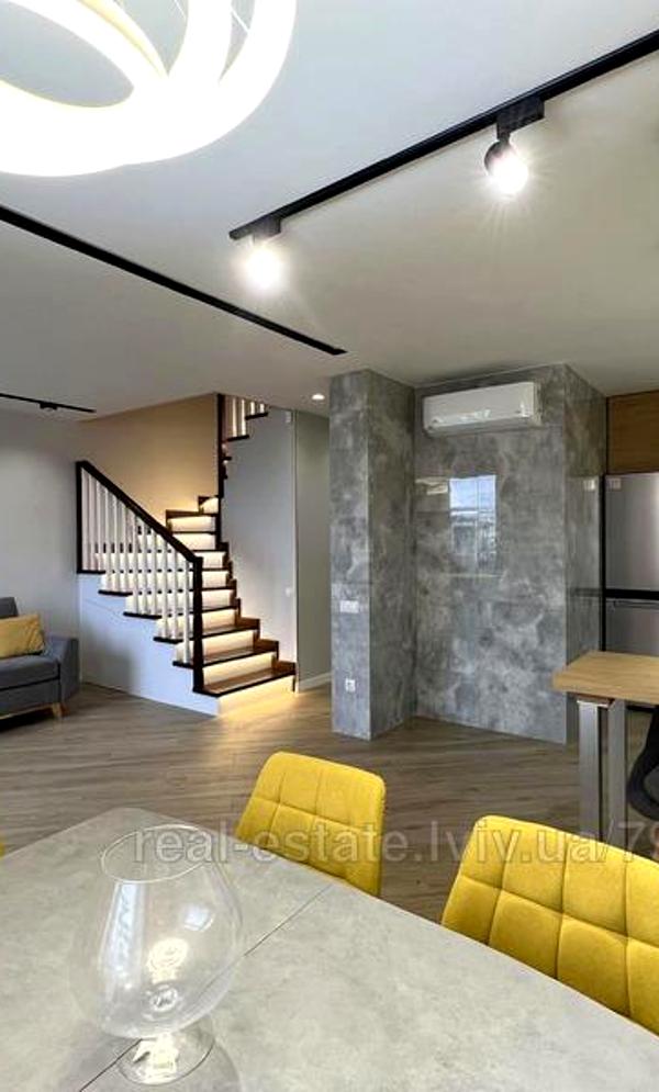 Modern Two-Level Apartment with Designer Renovation and Full Amenities