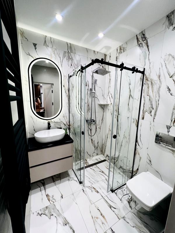 City Center Apartment with Designer Renovation and Modern Amenities