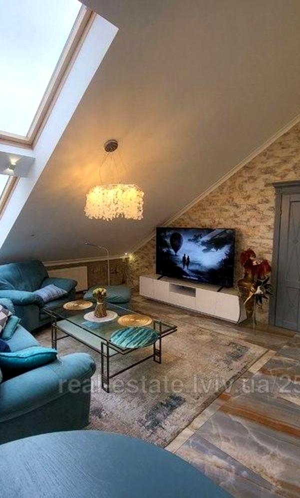 Spacious Attic Apartment with Designer Interior and Multiple Amenities