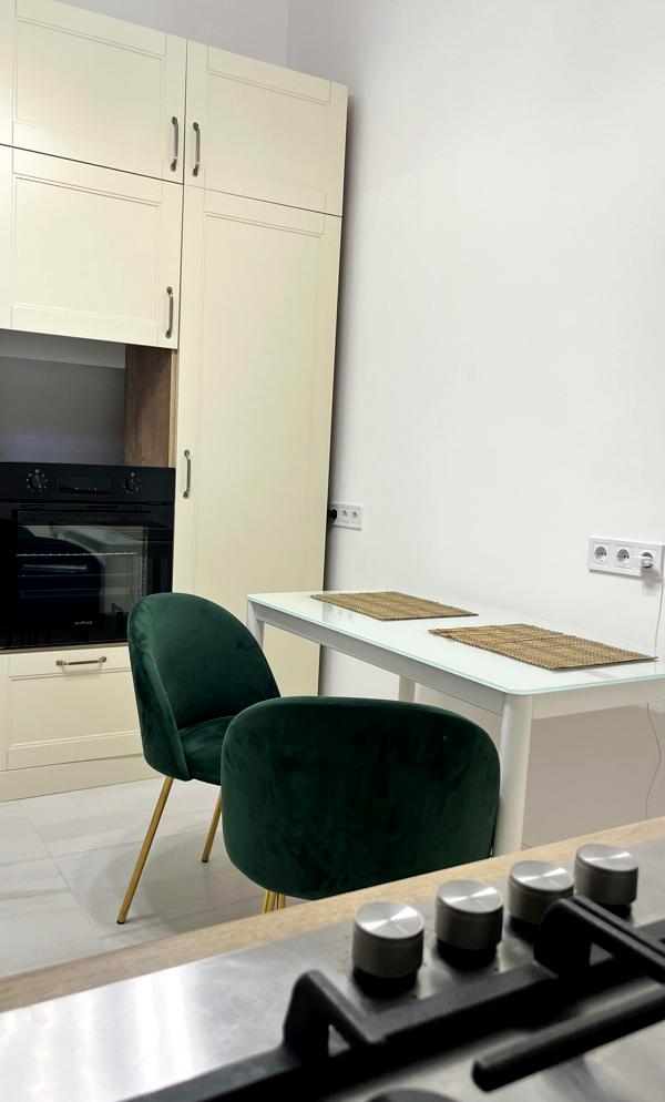 Two-room apartment with high ceilings, gas heating, and balconies