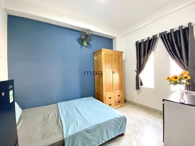 Modern Studio with Natural Wood Furniture in District 7