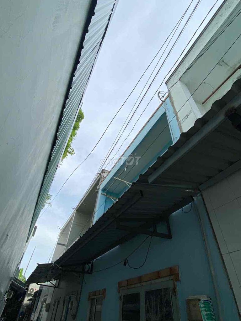 Two-Story House with Balcony and Car Access
