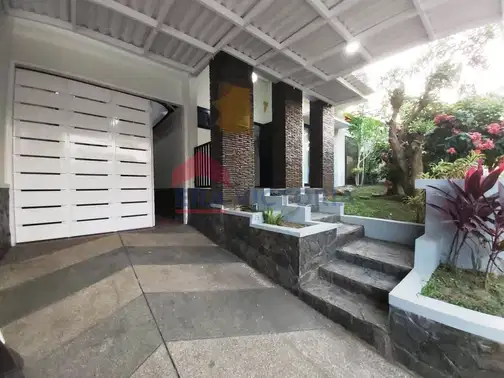 Minimalist 2-Story House with Front and Rear Gardens in Ijen Nirwana Residence, Malang
