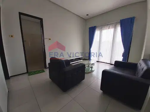 Minimalist 2-Story House with Front and Rear Gardens in Ijen Nirwana Residence, Malang