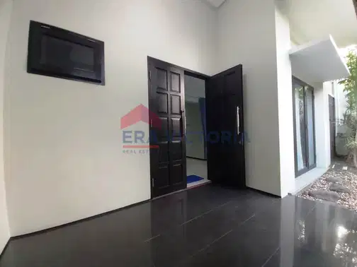 Minimalist 2-Story House with Front and Rear Gardens in Ijen Nirwana Residence, Malang