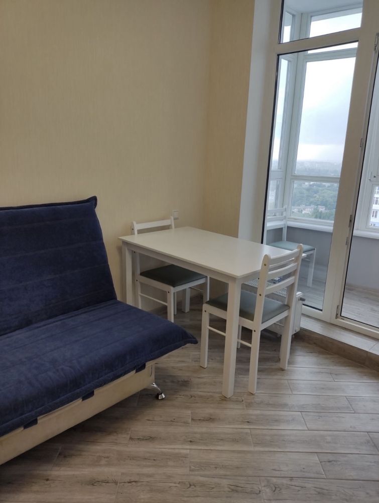 Two-bedroom apartment with modern design, balcony, and city view