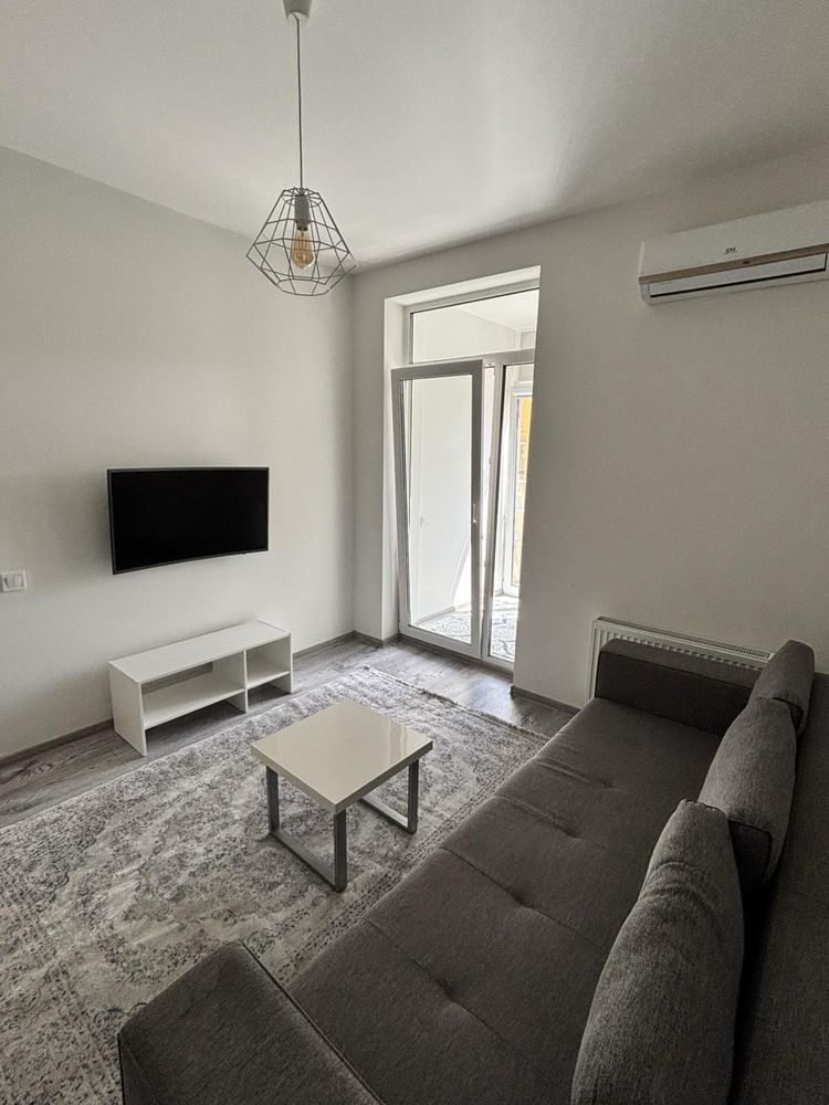 One-bedroom apartment with separate bedroom and spacious kitchen-studio