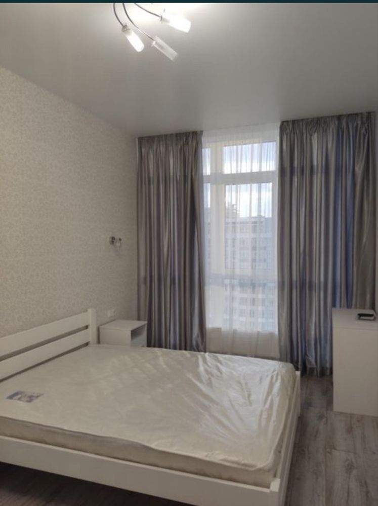 Two-bedroom apartment with modern design, balcony, and city view
