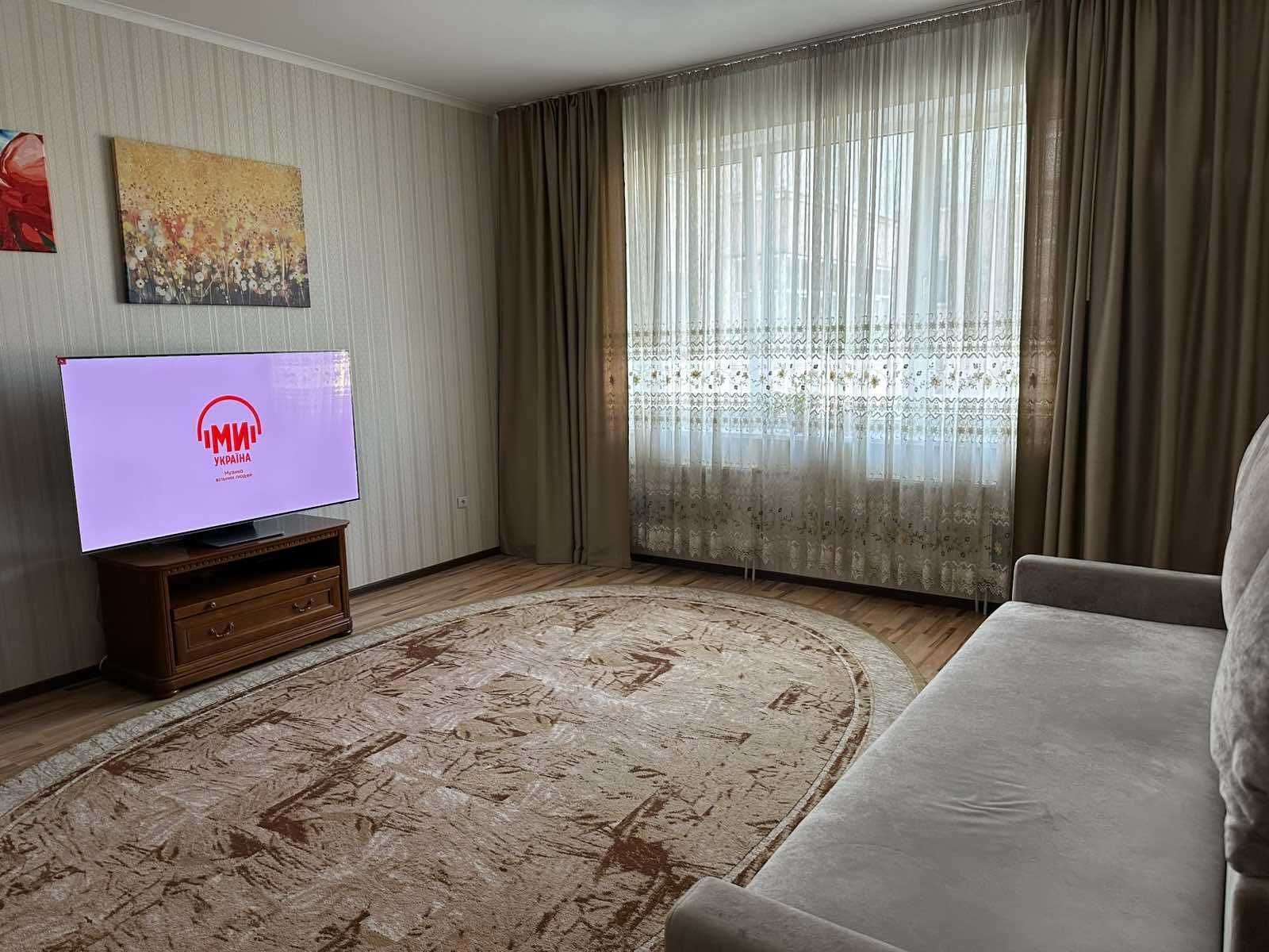 Spacious 2-bedroom apartment with high ceilings in a luxury building