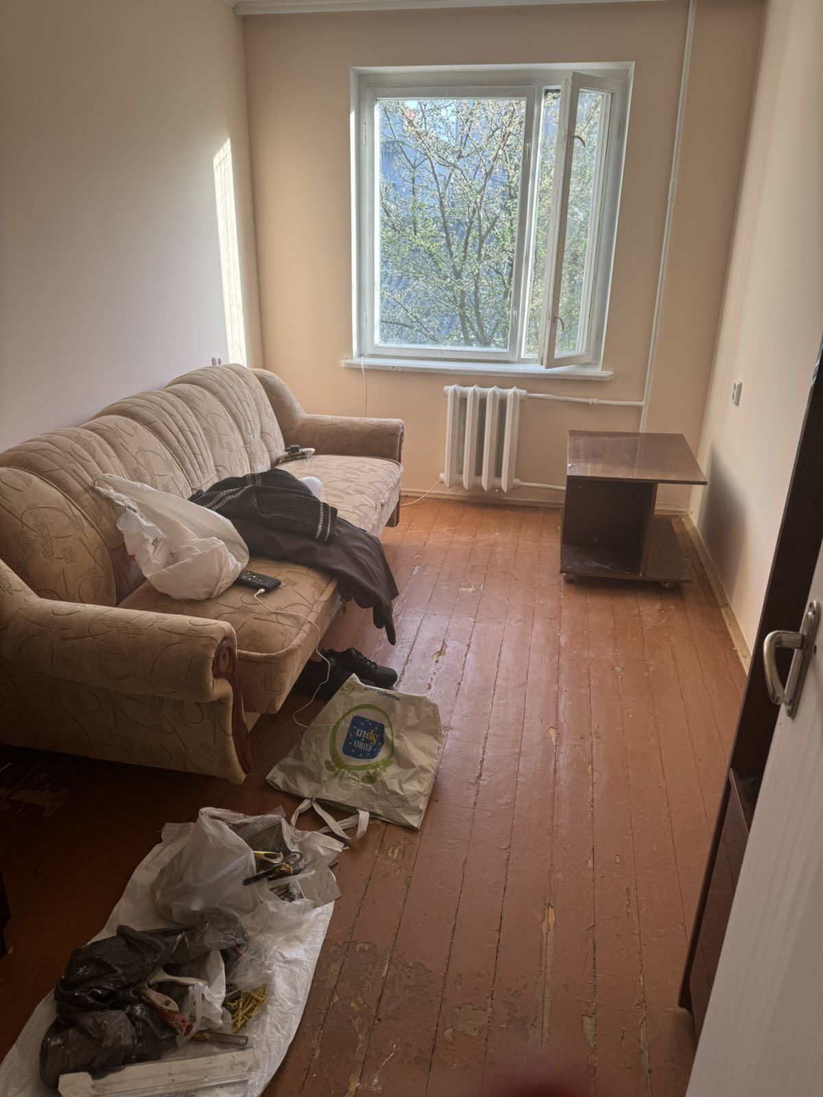 Two separate rooms with furniture, washing machine, and refrigerator