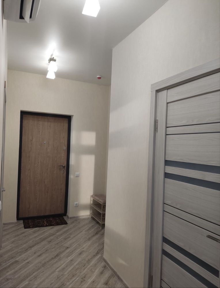 Two-bedroom apartment with modern design, balcony, and city view