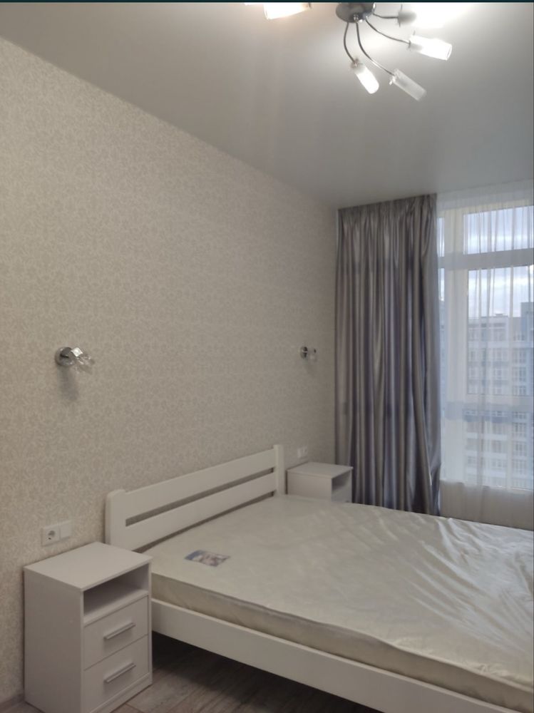 Two-bedroom apartment with modern design, balcony, and city view