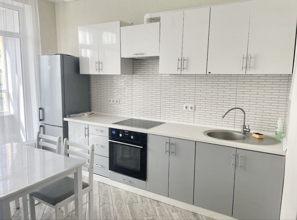 Two-bedroom apartment with modern design, balcony, and city view