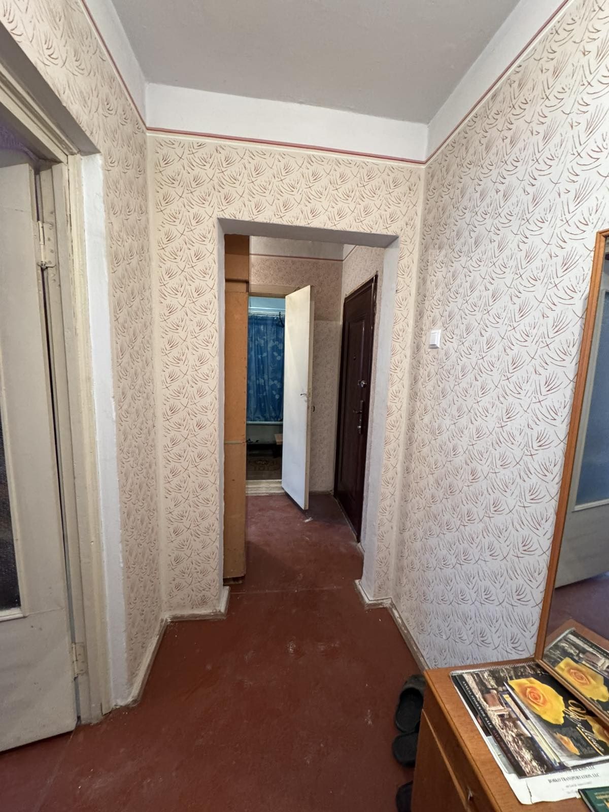 Two separate rooms with furniture, washing machine, and refrigerator