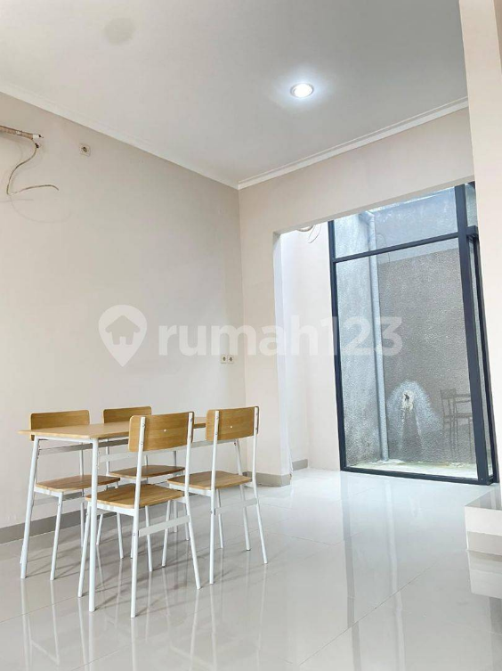 Semi-furnished 2-bedroom house with garden access