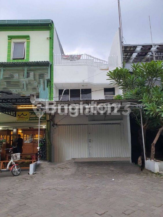 Three-Story Commercial Building in Green Garden
