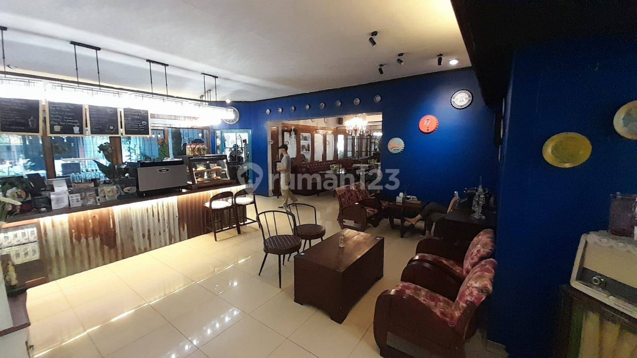 Spacious Two-Story Commercial Space with Cafe Setup