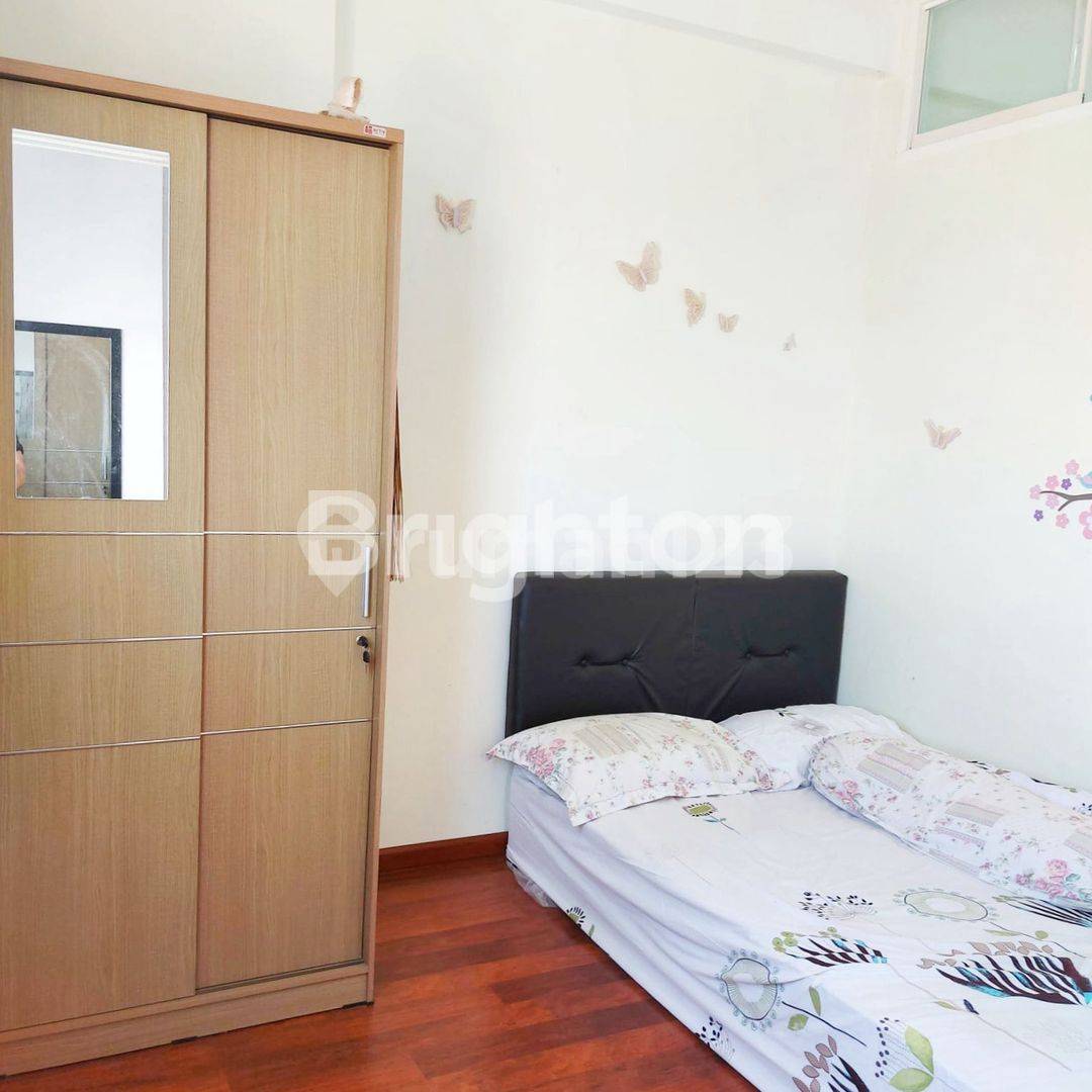 2BR Apartment at Puncak Dharmahusada - Comfortable Living Space